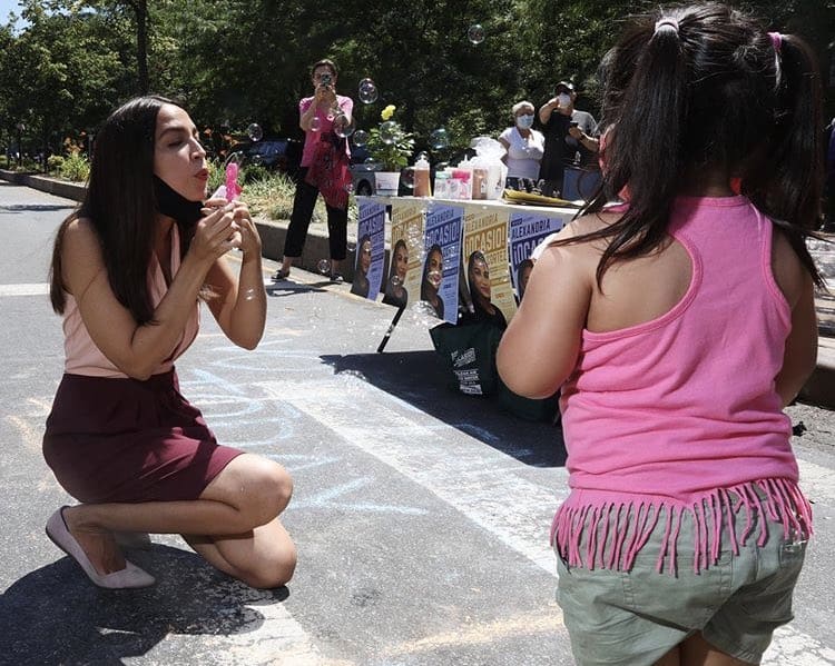 Attempted Murder? AOC Removes Face Mask, Blows Bubbles At Defenseless Child