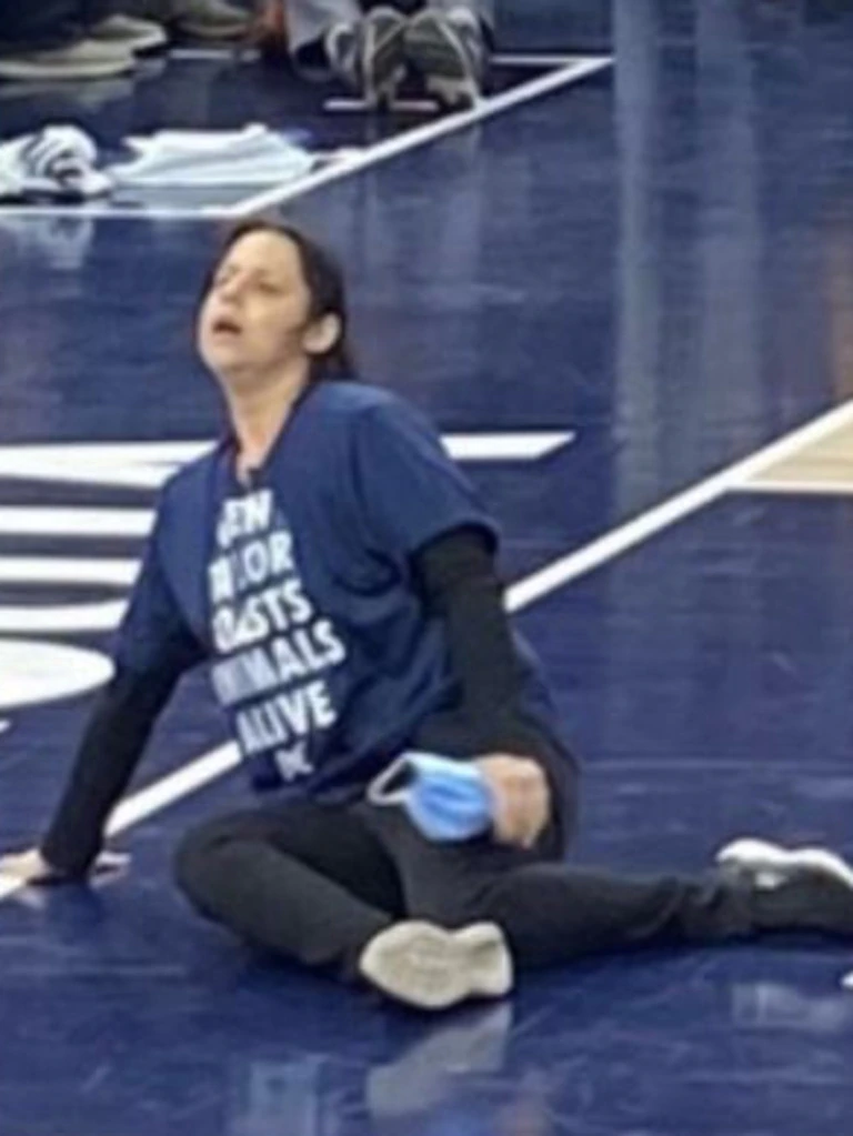 Woman Attempts To Glue Herself To Court In Protest During NBA Game