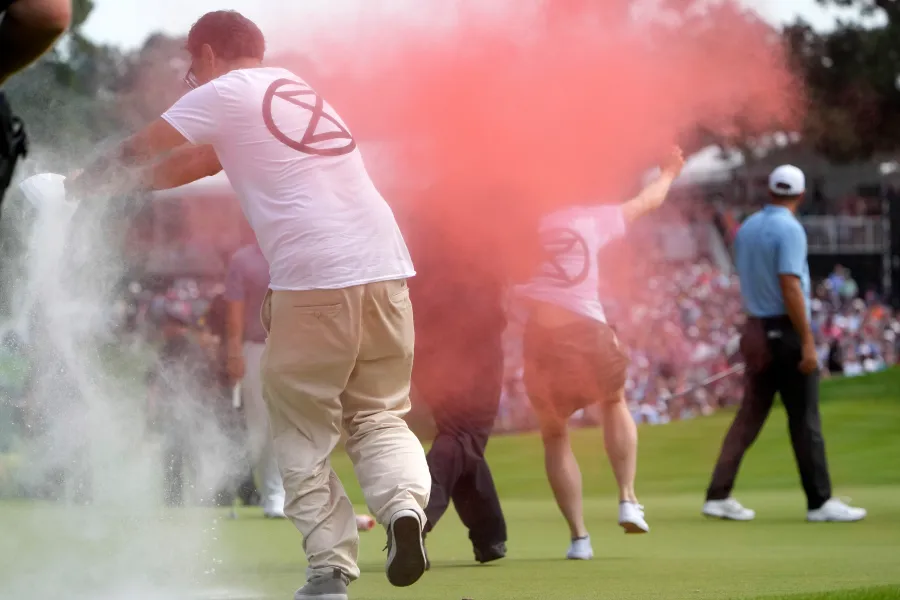 WATCH: Climate Protesters Storm The Green During Golf Tournament