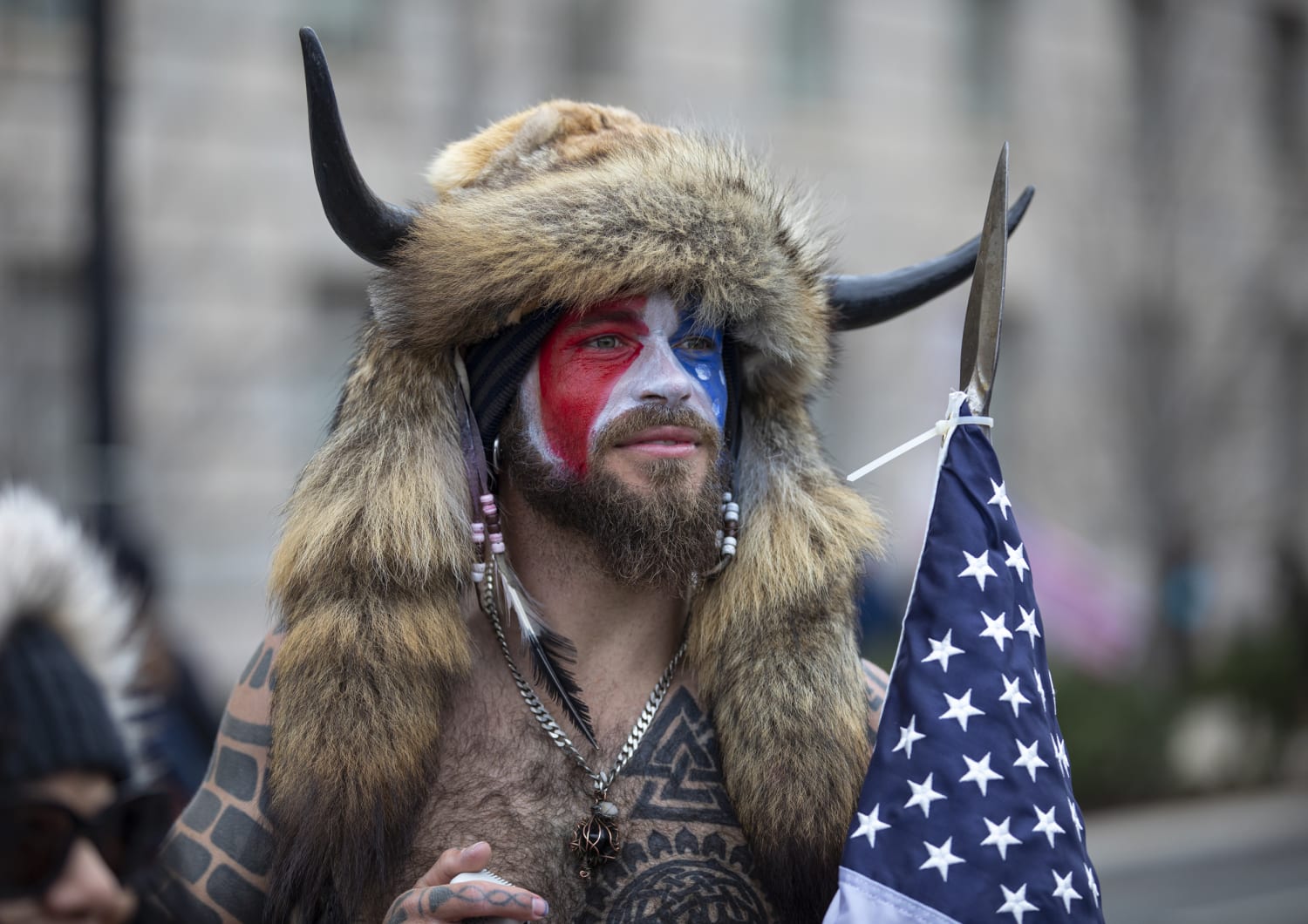 Judge Allows ‘QAnon Shaman’ To Get Back Helmet And Spear