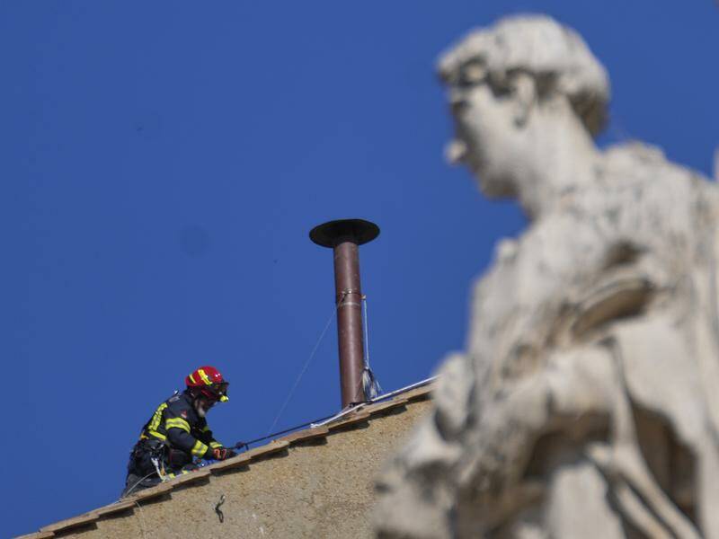 Vatican Firefighters Install A Chimney On Roof Of The Sistine Chapel For Papal Election