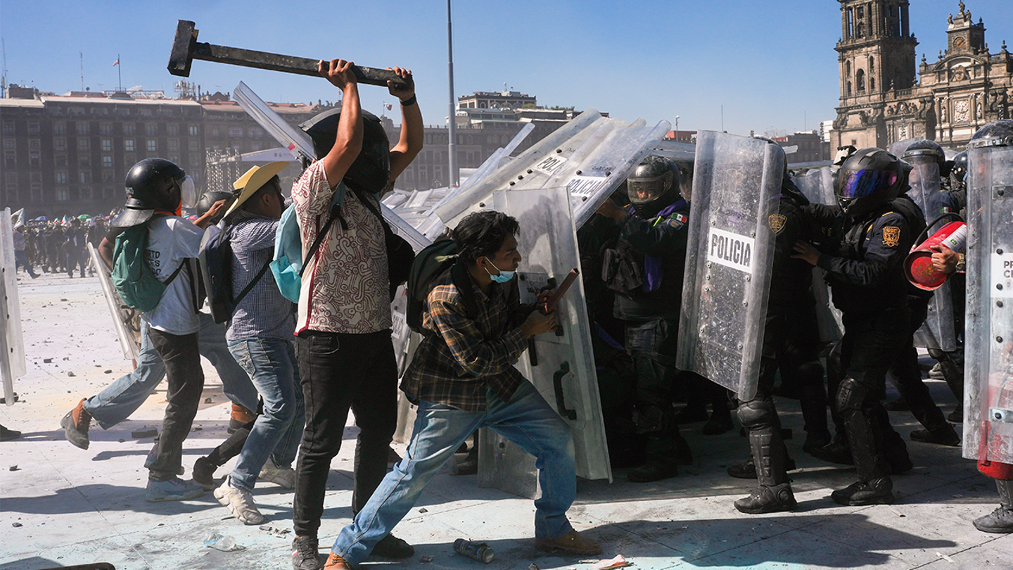 More Than 100 Officers Injured As Protesters Attack Police, Breach Barrier At Mexico’s National Palace