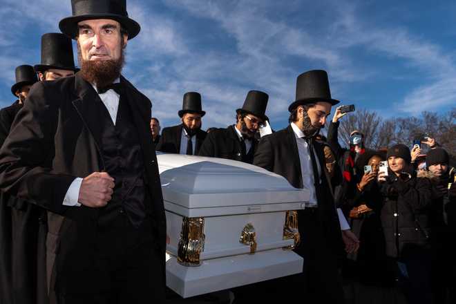 Hundreds Attend Mock Funeral For The Penny At The Lincoln Memorial