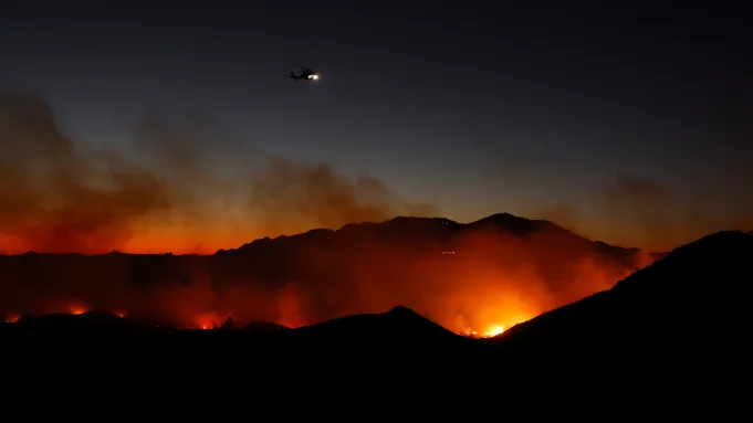 Wind-Fueled Wildfire Races Through Malibu As Power Cut To Thousands Of Homes